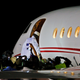 Former Gambian president Yahya Jammeh boards a private jet before departing Banjul airport.